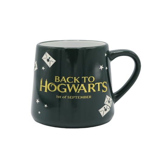 Dark green mug with 'Back to Hogwarts' text and design elements on a transparent background