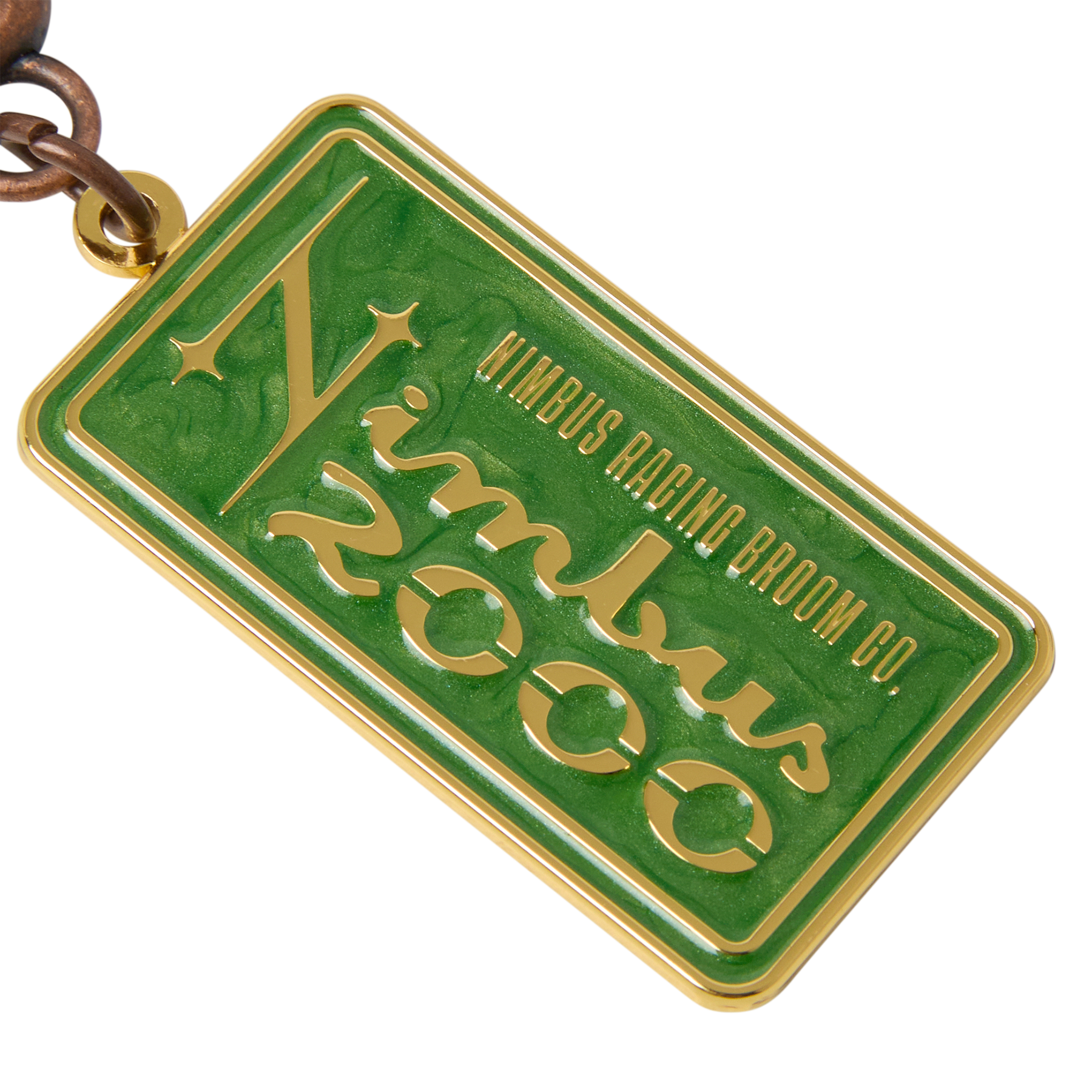 Green and gold rectangular tag with 'Nimbus Racing Broom Co.' text on a white background