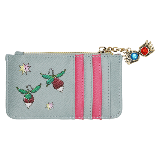 A light blue faux leather zippered pouch featuring embroidered radish earrings, pink  stripes, and a gold-tone Spectrespecs charm with blue and red crystals in the lenses.