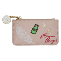 A pink faux-leather zip pouch featuring embroidered designs from Harry Potter, including a white feather, a green potion bottle, two yellow stars, and the red embroidered text 'Hermione Granger'. A gold-tone metal zipper runs across the top, accompanied by a gold chain and a circular Swarovski crystal charm.