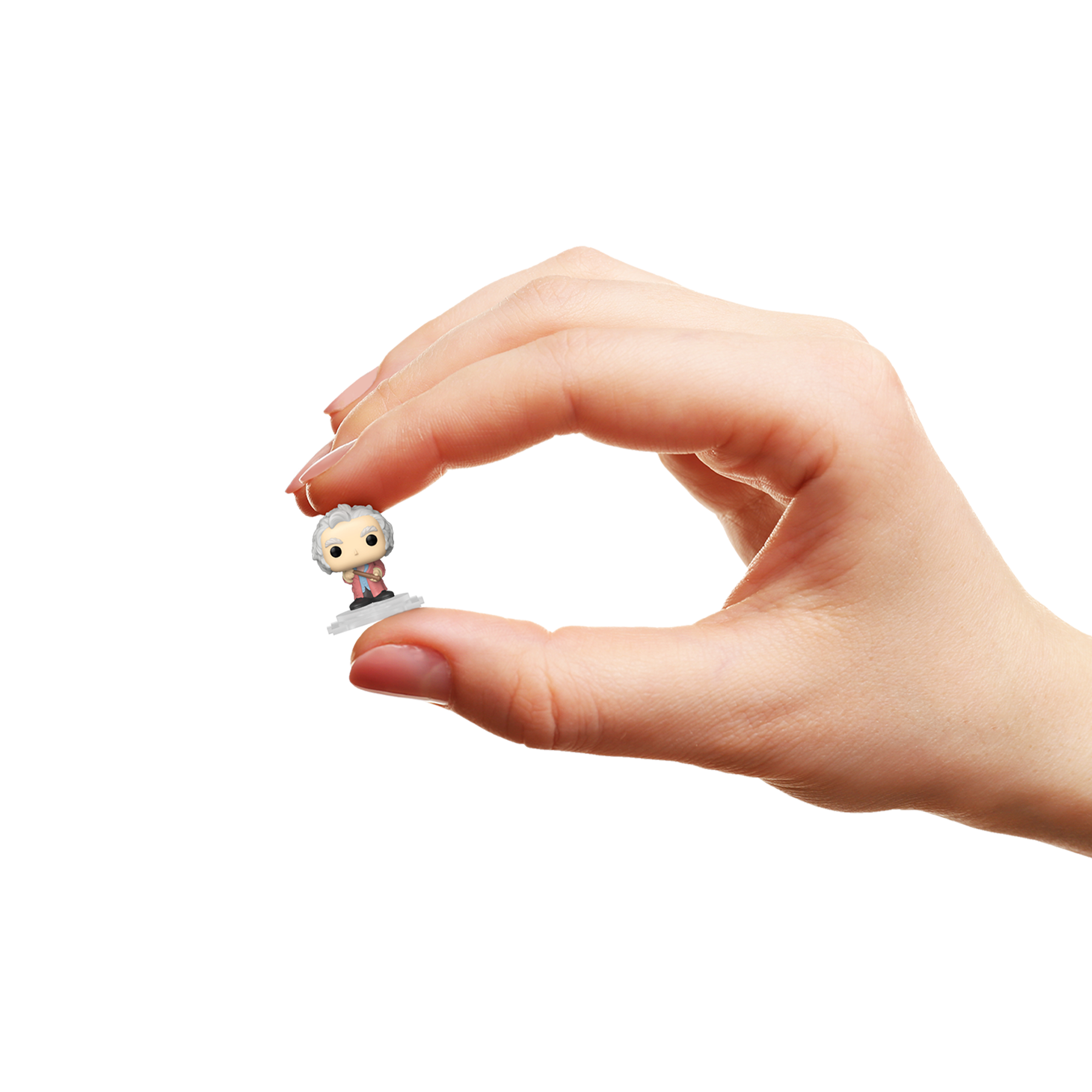 Hand holding a small POP! figurine of Garrick Ollivander
