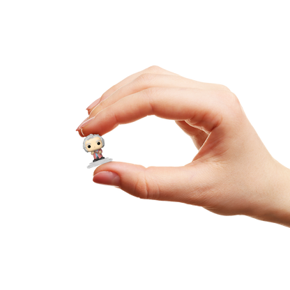 Hand holding a small POP! figurine of Garrick Ollivander