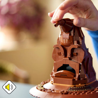 Hand holding a LEGO model of the Sorting Hat with a blurred background