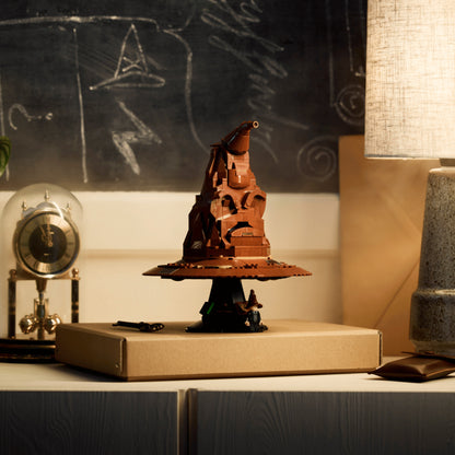 Talking Sorting Hat LEGO on a book with a chalkboard background